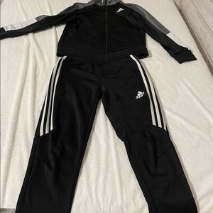 Adidas it is black and white sweatpants and matching sweater size Both M